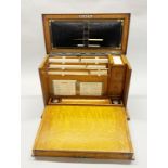 A superb Edwardian light oak stationery case/ writing slope, with original stationery and