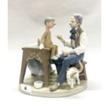 A boxed porcelain Lladro figurine of Pinocchio being made by Geppetto, H. 24cm. (very slightly A/F