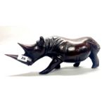 A carved figured ebony rhino, L. 42cm, H. 16cm.