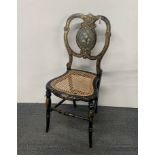 A lovely 19th century mother of pearl inlaid painted and gilt bedroom chair.