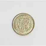 An uncirculated 1816 King George III shilling.