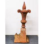 A large terracotta roof ridge finial, H. 102cm.