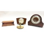 Two wooden mantle clocks, together with a brass ashtray and a wooden inkwell, tallest H. 23cm.