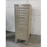 A vintage metal graduated nine drawer cabinet, 35 x 49 x 99cm.