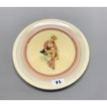 A Clarice Cliff porcelain plate with later added skating decoration, Dia. 26cm.