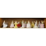 A group of twelve Franklin Mint porcelain figures, H. 13cm.