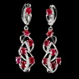 A pair of 925 silver drop earrings set with oval cut rubies and white stones, L. 4.1cm. Condition