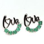 A pair of 925 silver "Love" earrings set with emeralds, L. 1.2cm. Condition NEW, includes gift