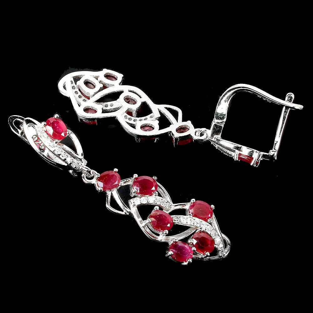A pair of 925 silver drop earrings set with oval cut rubies and white stones, L. 4.1cm. Condition - Bild 2 aus 2
