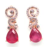 A pair of 925 silver rose gold gilt drop earrings set with pear cut rubies and white stones, L. 2.