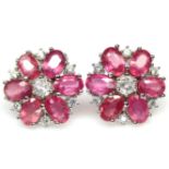 A pair of 925 silver cluster earrings set with oval cut rubies and white stones, Dia. 1.6cm.