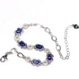 A pair of 925 silver bracelet set with cabochon cut sapphires, L. 18cm. Condition NEW, includes gift
