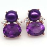 A pair of 925 silver earrings set with oval cut amethysts and magenta pearls, L. 1.4cm. Condition
