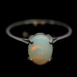 A 925 silver solitaire ring set with a cabochon cut opal, (P). Condition NEW, includes gift pouch.