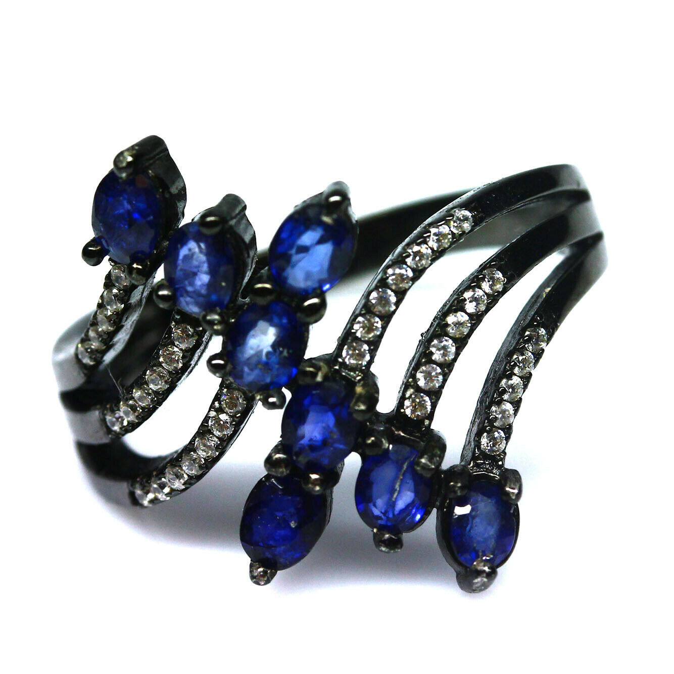 A 925 silver ring set with marquise cut sapphires and white stones, (K). Condition NEW, includes