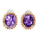 A pair of 925 silver cluster earrings set with a large oval cut amethyst and fancy orange sapphires,