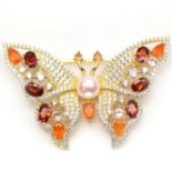 A 925 silver gilt butterfly shaped brooch set with garnets, fire opals, pearl and white stones, L.