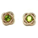 A pair of 925 silver rose gold gilt earrings set with peridot and white stones, L. 1cm. Condition