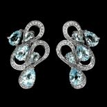 A pair of 925 silver earrings set with pear cut blue topaz and white stones, L. 3cm. Condition