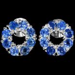 A pair of 925 silver stud earrings set with round cut sapphires, Dia. 1.1cm. Condition NEW, includes