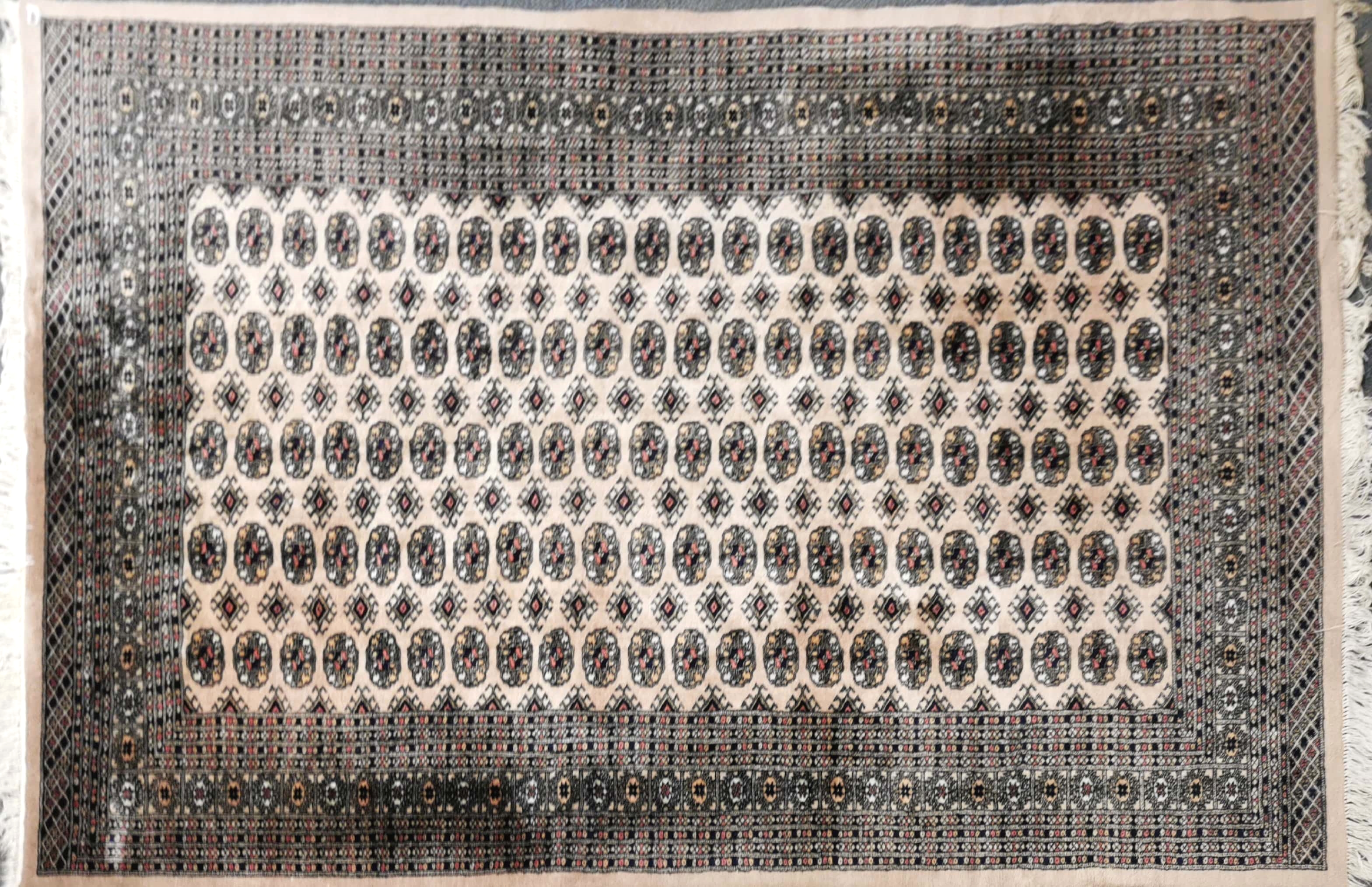 A large Eastern wool rug, 190 x 280cm.