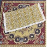 A tapestry table rug, 148 x 148cm. together with a 1970's table rug.