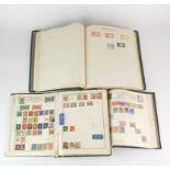 A group of three stamp albums.