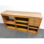 A 1970's two section teak veneered extendable bookcase sideboard, closed size 140 x 75cm.