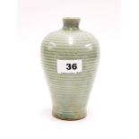 A Chinese ribbed celadon glazed porcelain vase, H. 17cm (some age crackle to glaze). Provenance: