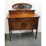 An Edwardian inlaid mahogany two door cabinet with later added back mirror, 94 x 45 x 111cm.