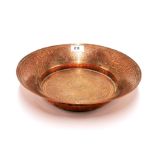 Islamic interest: An intricately engraved copper bowl, Dia. 30cm, D. 5.5cm.