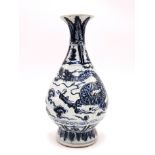 A Chinese hand painted porcelain vase decorated with a dragon among clouds, H. 36cm. Provenance: