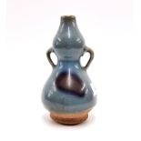 An interesting Chinese Zhun glazed, double gourd shaped pottery vase, H. 17cm. Provenance: estate of