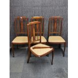 A set of four Edwardian inlaid mahogany dining chairs (one leg detached).