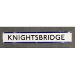 An original enamelled metal sign for Knightsbridge Underground station, 140 x 23cm.