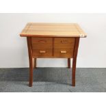 A contemporary two drawer pine side table, 65 x 46 x 73cm.