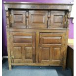 A superb 18th early century carved oak court cupboard carved with the initials R.W.A and dated 1727,