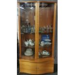 A bow front glazed contemporary display cabinet W. 95cm. H. 191cm.
