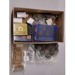 A box of mixed British and other coins.