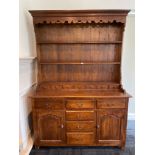 An impressive oak dresser in an 18th century style, 153 x 218cm.