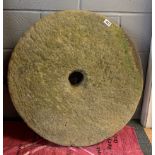 An early millstone, Dia. 72cm.
