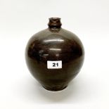 A Chinese brown glazed pottery vase, with subtle leaf decoration, H. 22cm, Dia. 19cm (small repair