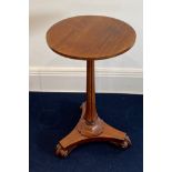 An early 19th century rosewood veneered pedestal wine table, Dia. 45cm, H. 74cm.