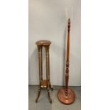 A mahogany plant stand, H. 102cm, with a turned mahogany standard lamp.