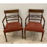 A pair of inlaid mahogany Regency style bedroom chairs