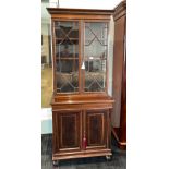 A fine Edwardian inlaid mahogany bookcase over two door cupboard, 79 x 189cm.