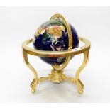 A gilt brass and semi-precious stone inset globe, H. 37cm.