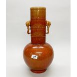 A large Chinese orange and red glazed porcelain vase with elephant head handles, H. 45cm.