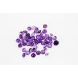 A bag of unmounted round cut amethysts, approx. 35ct total.