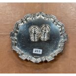 A hallmarked silver salver, Dia. 25.5cm, together with a pair of hallmarked silver napkin rings.